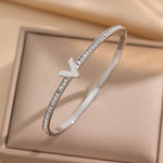 Modern luxury fine art editorial silver jewelry designer inspired V shape bracelet gift for her.