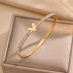Hypoallergenic non-tarnish high polish gold rigid architectural bangle UAE.