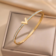 Hypoallergenic non-tarnish high polish gold rigid architectural bangle UAE.