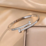Waterproof silver bypass bangle with baguette crystals Biya Accessoires UAE.