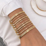 Waterproof 18K gold 14 piece textured bangle stack Biya Accessoires UAE.