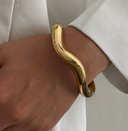 Waterproof 18K gold wavy liquid metal cuff bracelet Biya Accessoires UAE.