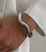 Waterproof silver wavy liquid metal cuff bracelet Biya Accessoires UAE.