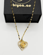 Hypoallergenic non-tarnish gold chain necklace with rose centerpiece.