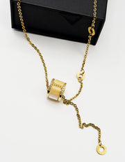 18K gold plated Roman style barrel lariat necklace by Biya Accessoires.