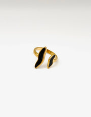18K gold plated black enamel abstract bypass ring by Biya Accessoires.