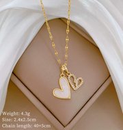 18K gold plated double heart pendant necklace with mother of pearl and crystals.