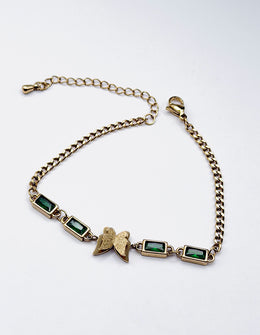 Hypoallergenic non-tarnish high polish gold green crystal station bangle UAE.