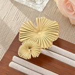 Modern luxury bold architectural leaf ring for women.