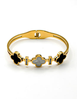 Gold bracelet with clover-shaped charms on a white background