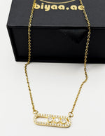 Waterproof gold horizontal oval necklace with moving stones.