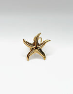 18K gold plated textured mid size starfish statement ring by Biya Accessoires.