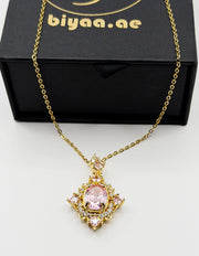 Waterproof gold royal pink gemstone style necklace on silk.
