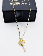 18K gold plated imperial crown key pendant with dancing stone by Biya Accessoires.