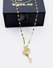 18K gold plated imperial crown key pendant with dancing stone by Biya Accessoires.