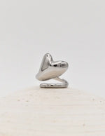 Silver love drop ring styled with dainty gold necklace