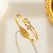Hypoallergenic stainless steel gold hinged bangle with crystals Dubai.
