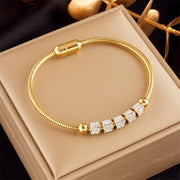 Hypoallergenic non-tarnish high polish gold crystal bangle UAE.
