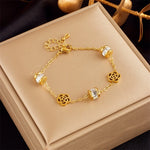 Hypoallergenic non-tarnish high polish gold crystal station bangle UAE.