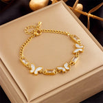 Hypoallergenic non-tarnish high polish gold crystal station bangle UAE.