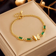 Waterproof gold frosted butterfly and green baguette charm bracelet UAE.