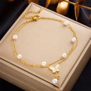 18K gold plated double chain pearl and butterfly bracelet by Biya Accessoires.