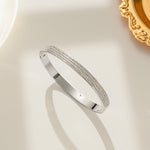 Modern luxury fine art editorial silver jewelry three row pave bracelet gift for her.
