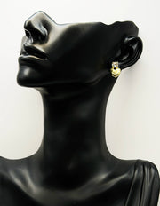 Close-up of premium hypoallergenic imitation jewelry featuring a romantic gold heart design.