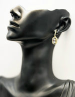 Everyday luxury fashion jewelry gold tone statement drops by Biya Accessoires Dubai.