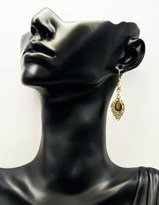 Best imitation jewellery brands in uae gold leaf earrings with brown stone and crystals.