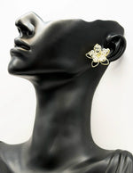 Close up of imitation jewelry uae statement earrings featuring beaded crystal petals.