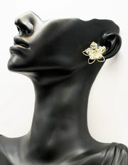 Close up of imitation jewelry uae statement earrings featuring beaded crystal petals.
