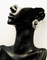 Best imitation jewellery brands in uae silver 3D multi-band geometric dangles.