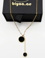 Close-up of premium hypoallergenic imitation jewelry featuring a geometric lariat design.