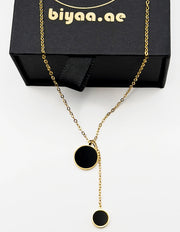 Close-up of premium hypoallergenic imitation jewelry featuring a geometric lariat design.