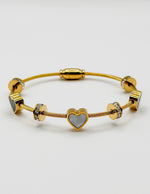 Non-tarnish luxury gold and black enamel heart bracelet for women.