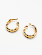 Biya Accessoires chunky gold hoop earrings with high-polish finish.