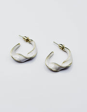 Close up of premium hypoallergenic imitation jewelry featuring a pearlescent cream design.