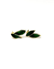 Pair of green leaf-shaped earrings on a white background