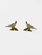 Biya Accessoires gold butterfly stud earrings with black enamel and crystals.