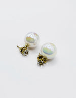 Close-up of premium hypoallergenic imitation jewelry featuring a large iridescent sphere.