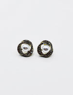 Biya Accessoires gold orbital pearl stud earrings with pavé crystals.