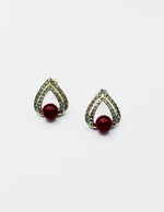 Biya Accessoires gold teardrop stud earrings with red pearl and crystal pavé.
