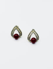 Biya Accessoires gold teardrop stud earrings with red pearl and crystal pavé.