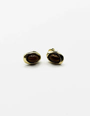 Biya Accessoires gold tiger eye stud earrings with molten frame.