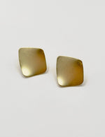 Biya Accessoires matte gold geometric curved stud earrings.