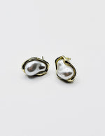 Pair of pearl earrings on a white background