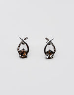 Biya Accessoires silver crystal infinity stud earrings.