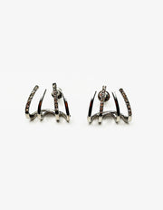 Biya Accessoires silver quad-claw crystal crawler earrings.