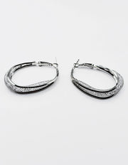 Biya Accessoires silver triple band hoop earrings with stardust texture.